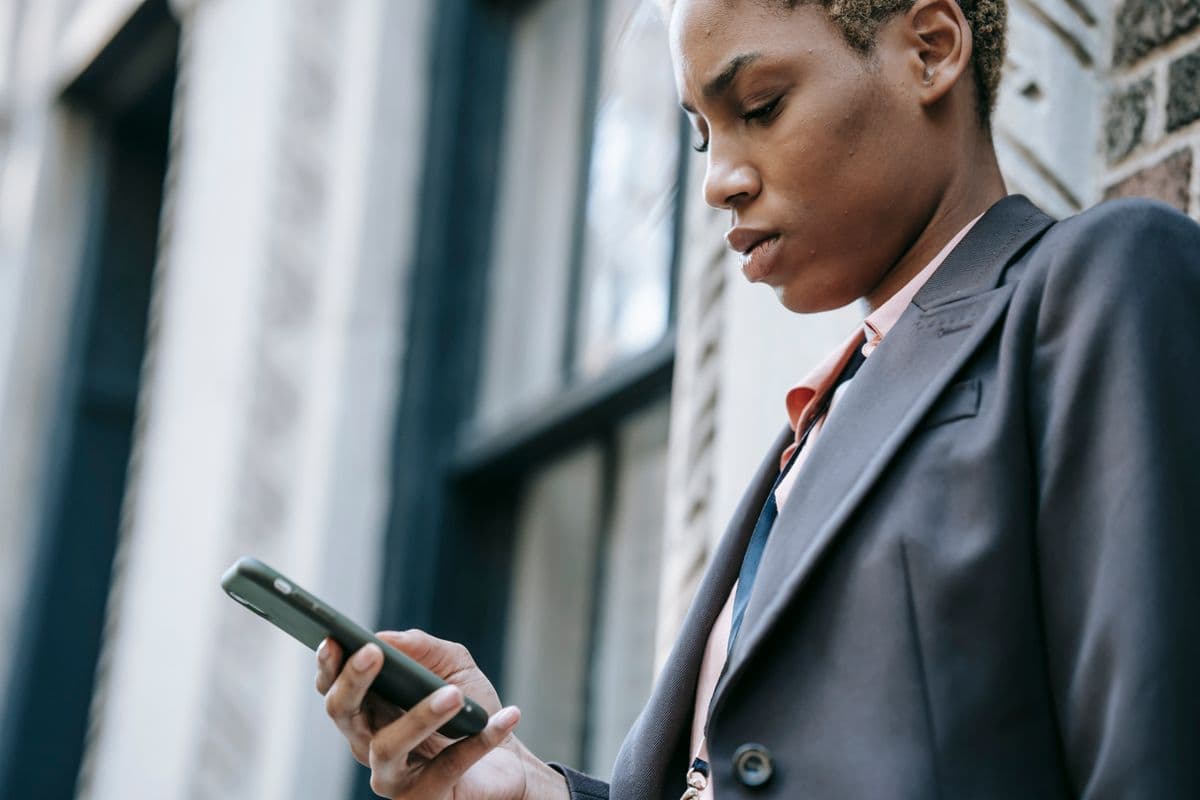 A professional checking an update on a phone